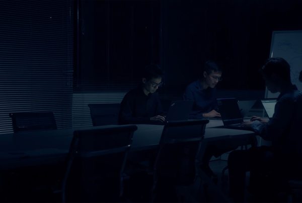 employee working in a meeting room during late hour